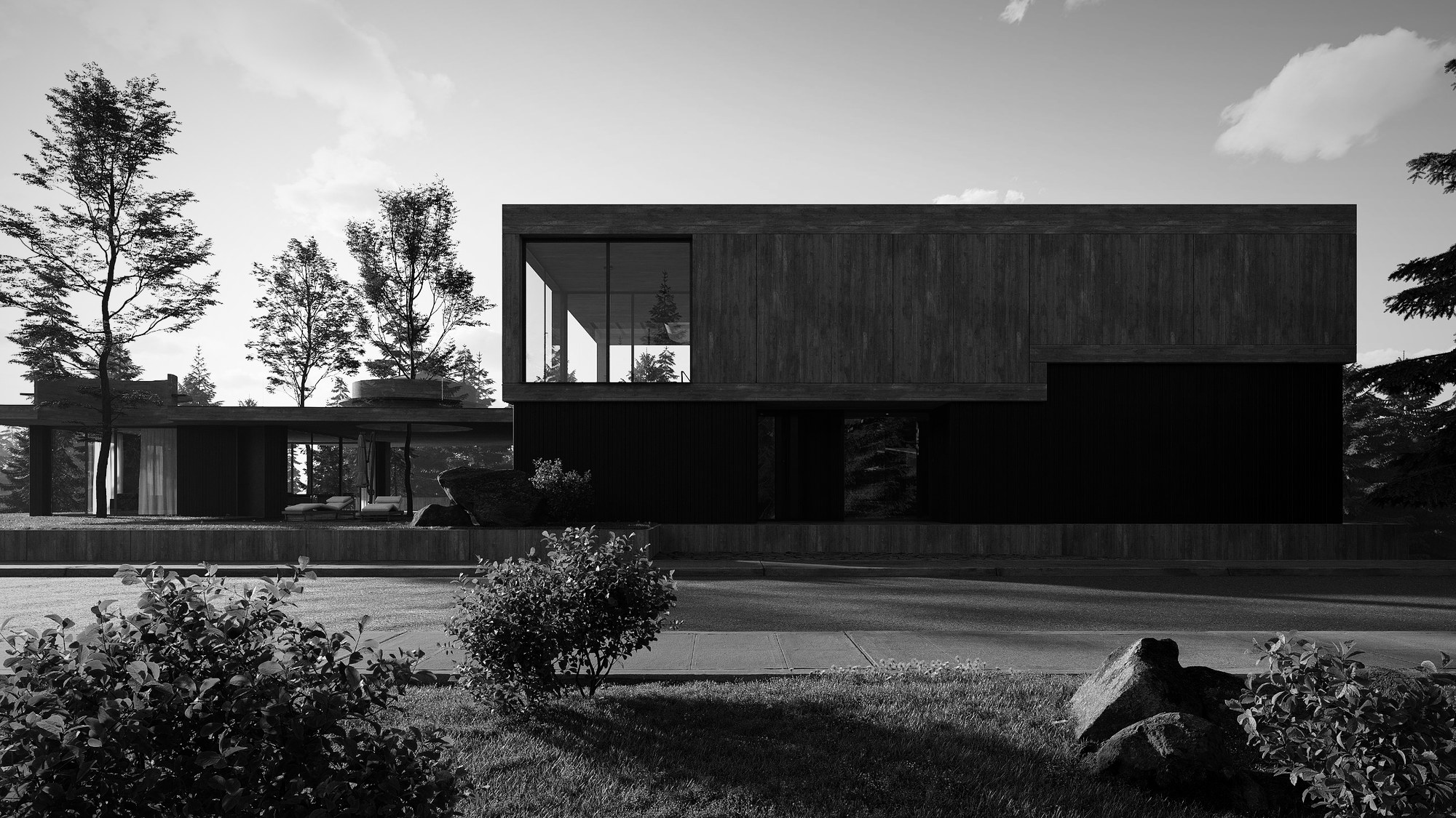 Strassenansicht mit dunkler Holzfassade und Sichtbeton