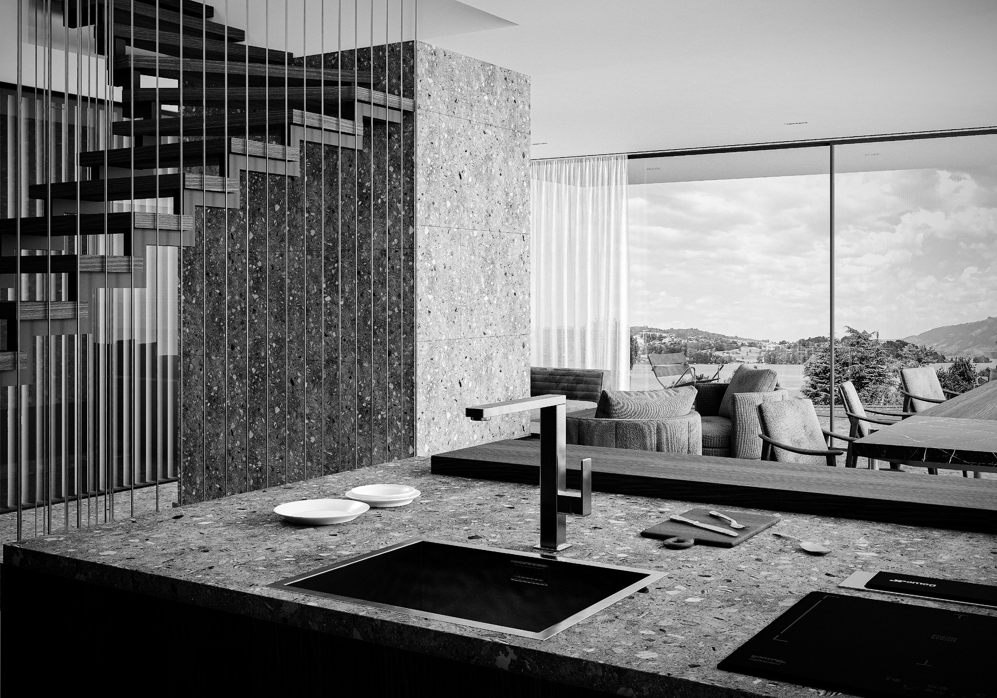 Küche mit Terrazzo-Insel, offener Treppe und Seeblick