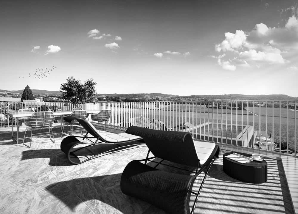 Dachterrasse mit Liegen und Weitblick über die Felder