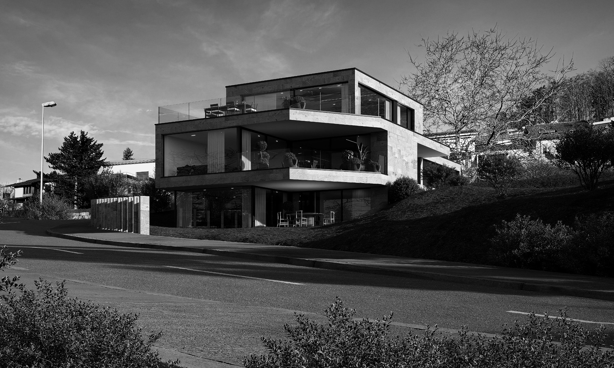 Dreigeschossiger Neubau mit grossen Glasfronten und Terrasse